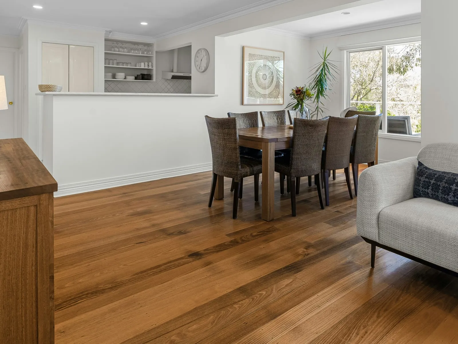 Living and dining room with a wide-plank wooden floor